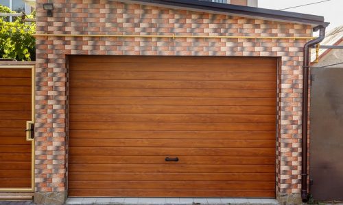 Dark Wooden Garage Door with colored brick wall background